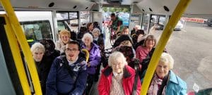 passengers boarding a bus during an outing